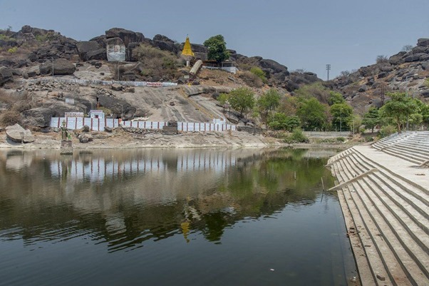 Padmakshi Temple on a rocky hill above a tank